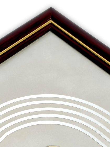 A close-up of the multi-suede mat frame. The rich wooden frame with a gold fillet complements the elegant, layered design of the matting, creating a piece that is a work of art in itself.