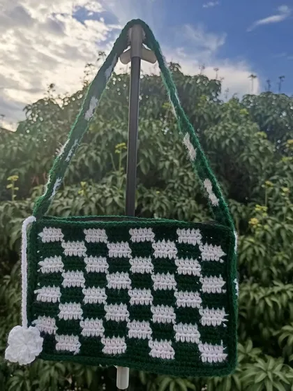 A custom-made checkered shoulder bag in green and white. The checkered pattern is a trendy design that I can create in any color combination.