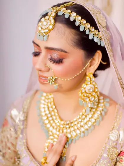 A close-up bridal portrait focusing on the stunning makeup and jewellery. Her serene expression and the beautiful details of her look are captured perfectly.