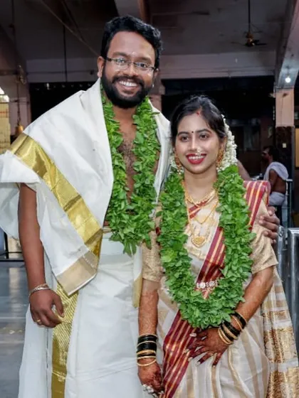 A beautiful couple at their Kerala wedding ceremony. The bride's saree is draped to be both traditional and comfortable, allowing her to move easily through the temple rituals.