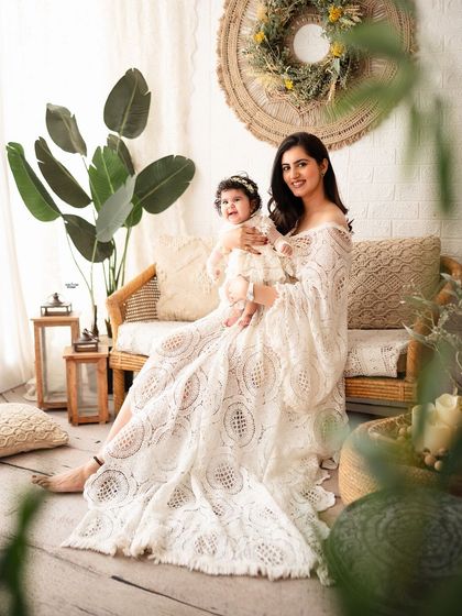 Another beautiful shot of the mother and daughter, framed by natural elements in the studio.