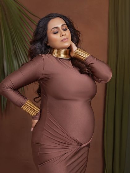 A moment of quiet reflection, with her eyes closed, feeling the connection with her baby.