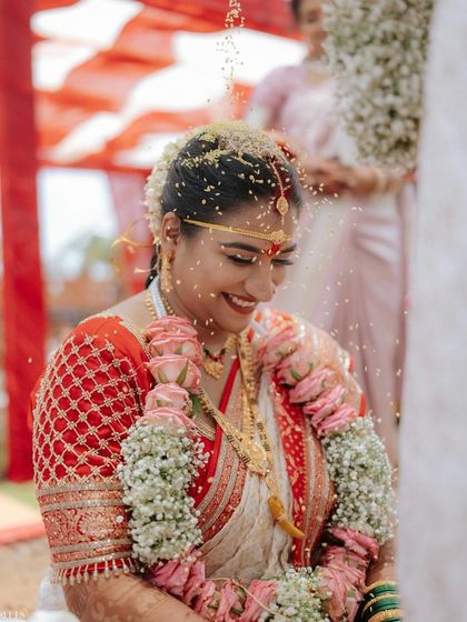 A joyful moment from the ceremony. The natural, radiant makeup enhances her happiness, creating a truly beautiful bridal memory.