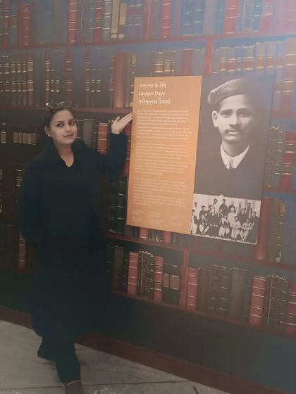 Pictured next to a historical legal exhibit. It shows my respect for the history of law and the figures who have shaped it, which informs my own practice today.