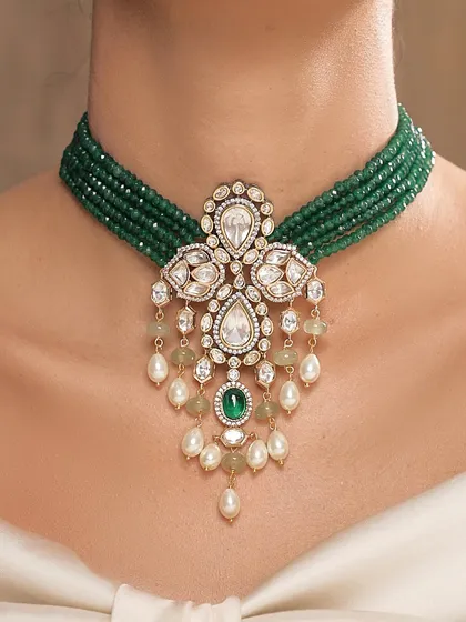 A closer look at the emerald and polki pendant choker, a versatile piece that can be worn for both bridal and festive occasions.