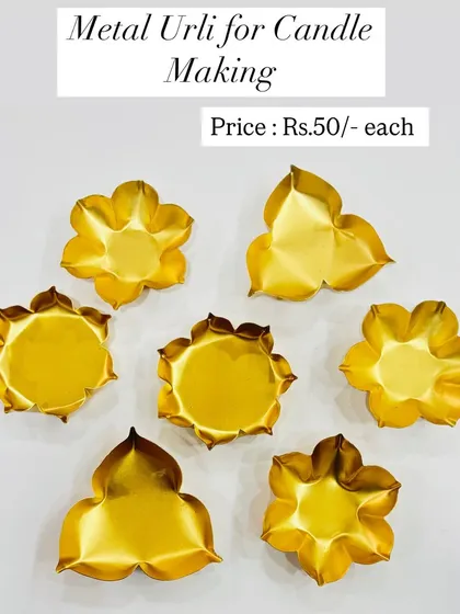 Our metal urlis for candle making start at just Rs. 50 each. This image shows a variety of flower-shaped urlis that are perfect for creating floating candle displays or decorative centerpieces.