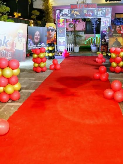 The grand entrance to the Bollywood party, complete with a red carpet, movie-style posters, and balloon pillars. It made every guest feel like a celebrity arriving at a movie premiere.
