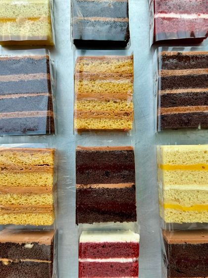 A top-down view of the variety of cake slices we offer. It's hard to choose just one!