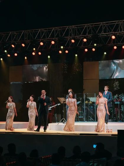 Another performance by the Shillong Chamber Choir, with the stage lit in beautiful gold and red hues.