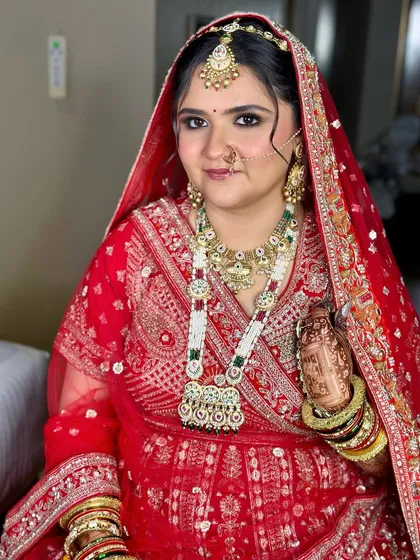 A beautiful portrait capturing the complete traditional look. The makeup, jewelry, and outfit come together in perfect harmony.