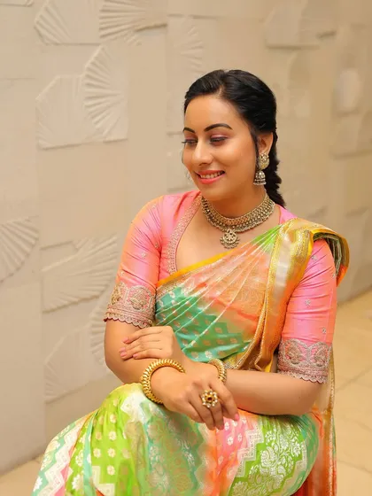 A final, beautiful portrait of Dr. Shruthi, her radiant smile the perfect accessory for this stunning saree.