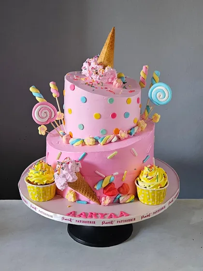 Who says whipped cream cakes can't be fun and whimsical? This two-tier topsy-turvy cake, created for a candyland-themed first birthday, shows how I can build slanted and playful structures that are still soft and delicious.