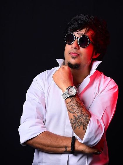 A clean, confident look in a white shirt. This photo represents the idea of building the future you want, starting today.