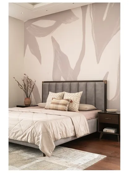 This wider shot of the master bedroom shows the full effect of the custom wallpaper, creating a sophisticated and artistic focal point behind the bed.
