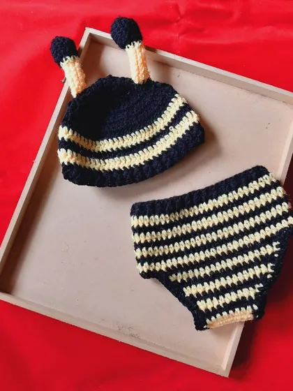 This is the baby boy version of my popular bumblebee outfit. It includes the striped beanie with antennae and a simple, comfortable striped diaper cover. It’s a perfect handmade costume for a "sweet as can bee" photoshoot.