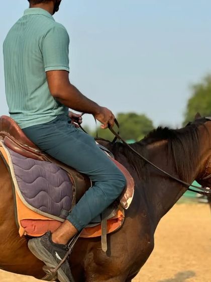 A view from behind a rider, showing the focus and control required for a successful ride.