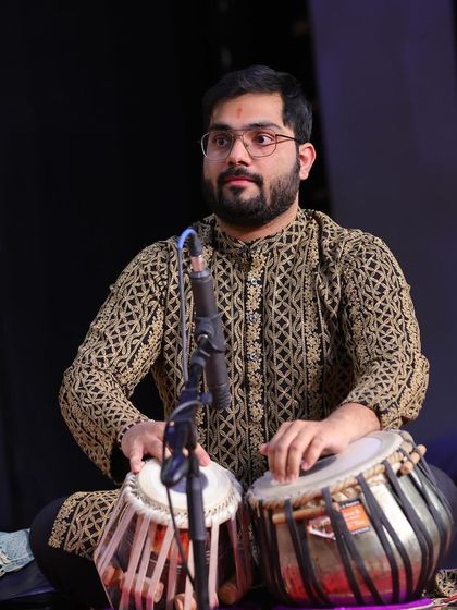 A performance shot where I am deeply focused on the taal, providing a solid rhythmic structure.