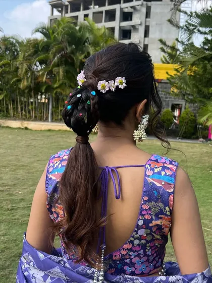 Another angle of the creative ponytail, a perfect inspiration for a bride who wants a fun and non-traditional hairstyle.