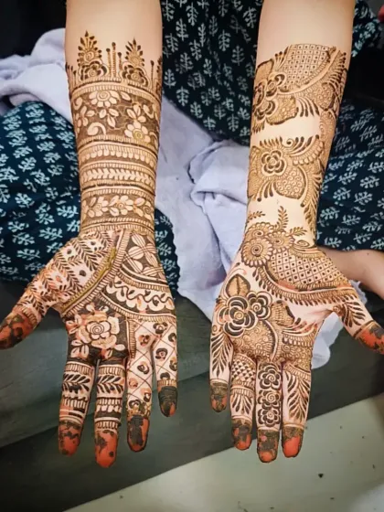 A unique design that combines a traditional floral cuff on one hand with a modern Arabic-style trail on the other.