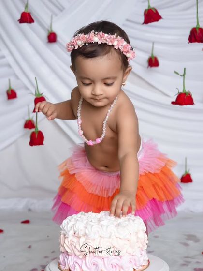 A moment of concentration as she carefully picks at her birthday cake.
