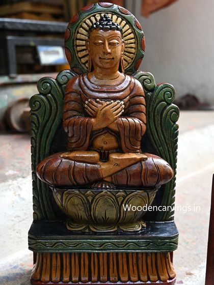 A seated Buddha in the Dhyana mudra (meditation gesture), hand-painted with a green and brown palette for a grounded, earthy feel.