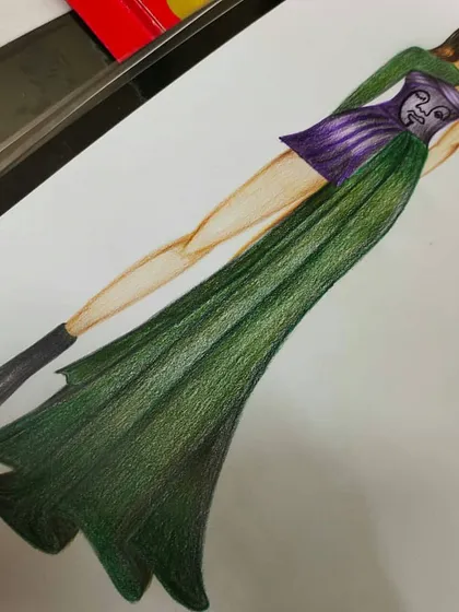 This fashion sketch displays a modern, edgy design with a green flowing skirt and a structured purple corset top. Our illustration course covers figure drawing and how to accurately represent complex garments on the human form.