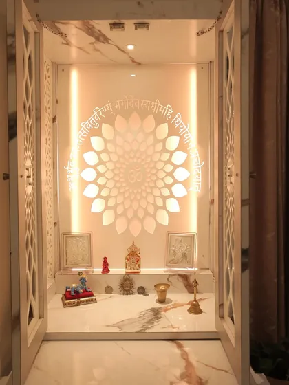 An open view of the marble-finish mandir, showing the backlit jaali and the spacious platform for placing idols and pooja essentials.