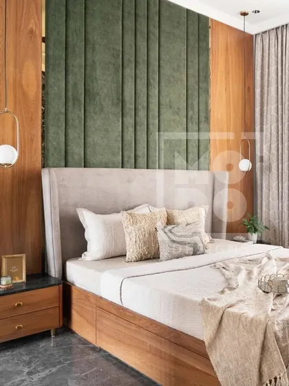Crafted with attention to every detail, this bedroom features bespoke furnishings and a serene color palette. The combination of green velvet, warm wood, and soft neutrals soothes the senses.