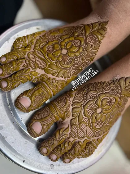 A close-up of the feet of the engagement bride. The design is just as detailed and beautiful as the henna on her hands.