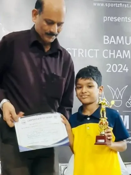 Rhys receiving his trophy and certificate at the BAMU District Championship award ceremony.