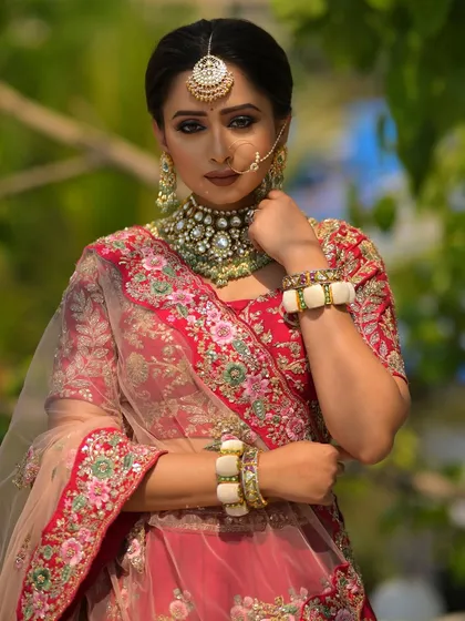A powerful and direct pose, showcasing the confidence that comes with feeling your best. The kohl-rimmed eyes and flawless base create a look that is both strong and traditionally beautiful.