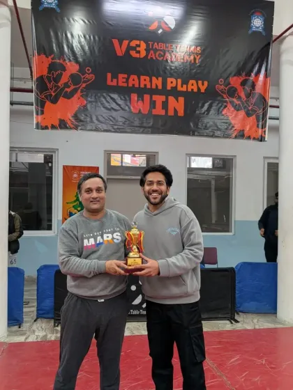 Celebrating a winner from our V3 Open Corporate Table Tennis Tournament. I organize competitive events for working professionals looking to test their skills outside the office.