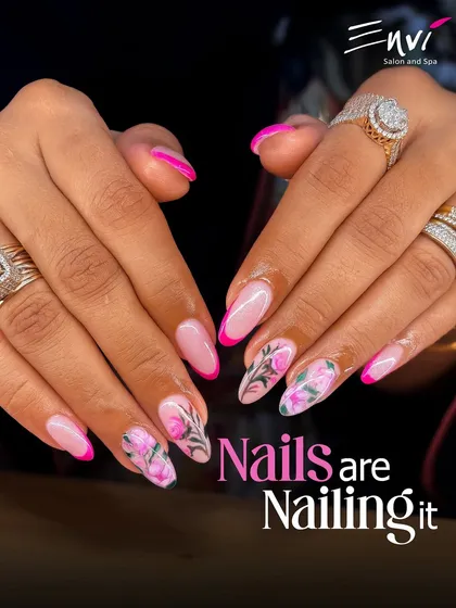 A closer look at our hand-painted floral nail art. This design combines a vibrant pink French tip with delicate, detailed rose patterns, showing my skill in creating bespoke and artistic manicures.