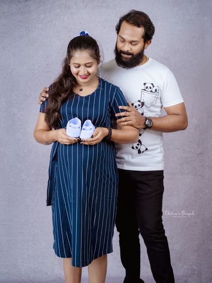 Another sweet shot with tiny baby shoes. This couple is all smiles as they anticipate their baby's arrival.