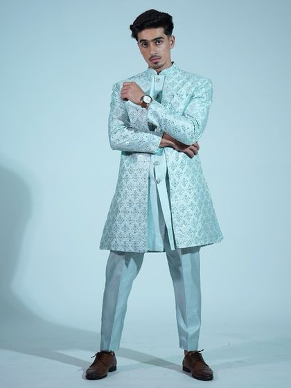 A full-length shot of the light blue sherwani, a perfect blend of traditional craftsmanship and modern style.