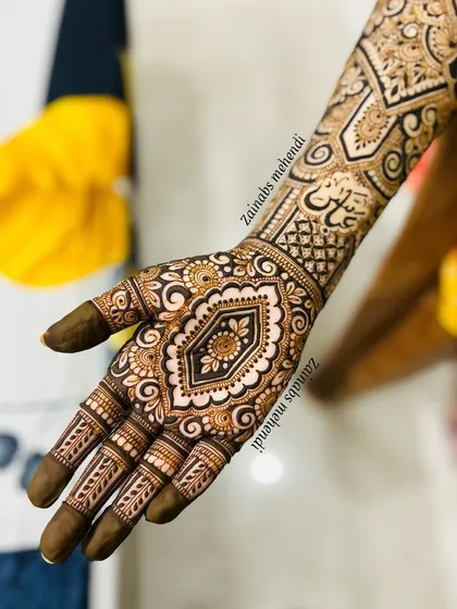The palm of bride Adiba, featuring her name beautifully written in Urdu calligraphy.