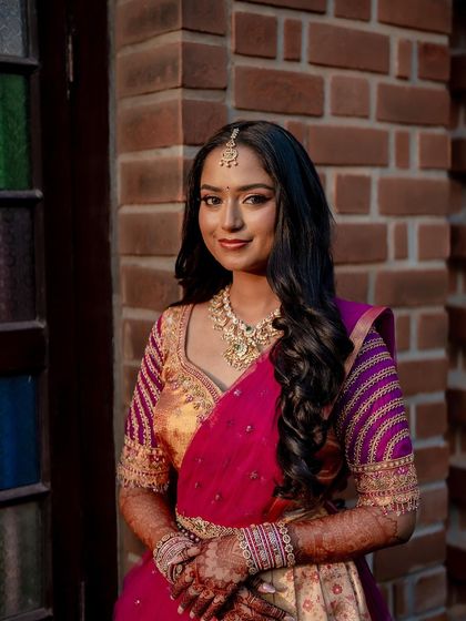 A lovely portrait of the bride, with the rich color of her henna adding to her traditional look.