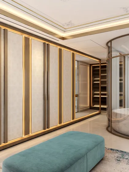 This palatial bathroom, part of a 2,000 sq. ft. master suite, features a large walk-in closet and a freestanding circular tub enclosed in glass. The design uses palatial stones and a modern twist on textures to create a truly regal experience.