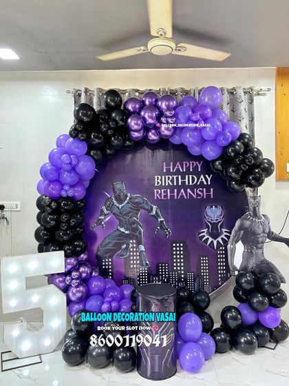 A powerful Black Panther theme for Rehansh's 5th birthday. The purple and black balloon arch and character cutouts create a scene straight out of Wakanda.