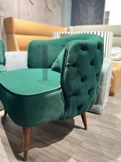 A showcase of my versatile accent chair designs. This includes a green velvet chair with a tufted back, and another model combining floral-print fabric with a mustard-yellow tufted back.