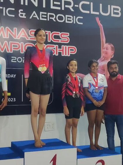 More moments of triumph from various competitions, showcasing our gymnasts with their medals, trophies, and proud coaches.