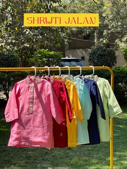 A rack of my plain linen kurtas in a variety of summer-ready colors. Each one features an embroidered neckline, adding a touch of elegance to a simple and comfortable design.