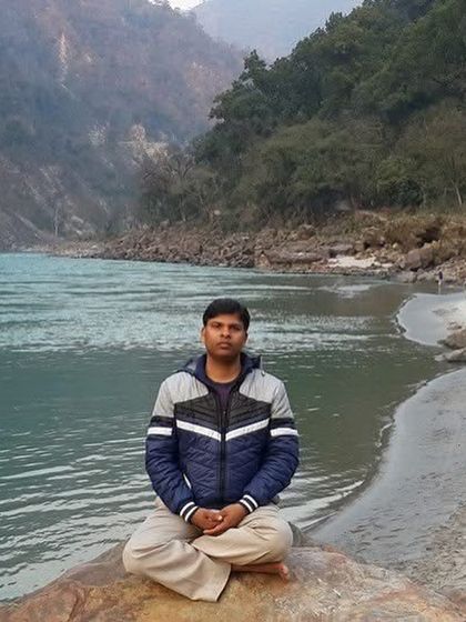 Meditating by the Ganges in the Himalayas. My journey, much like that of my friend Raghav Juyal, began in these divine lands. The peace and spiritual energy of this place are a part of who I am.