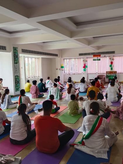 Another view of our spacious Delhi studio filled with practitioners during a special event, showing the scale and energy of our community gatherings.