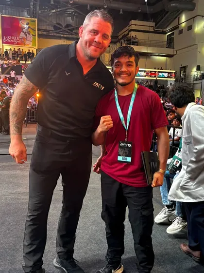One of our team members with a renowned international referee at an MFN event.