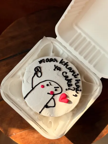 I love bringing your fun ideas to life! This cake features a popular meme character with the funny Hindi question "maar khani hai ya cake?" which translates to "Want a beating or cake?". It's a great example of how we can add a personal, humorous touch to any celebration.