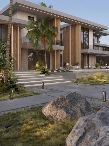 A wider view of the luxury farm landscape, showing how we used large natural boulders and varied plantings to create a dramatic and naturalistic setting for the modern home.