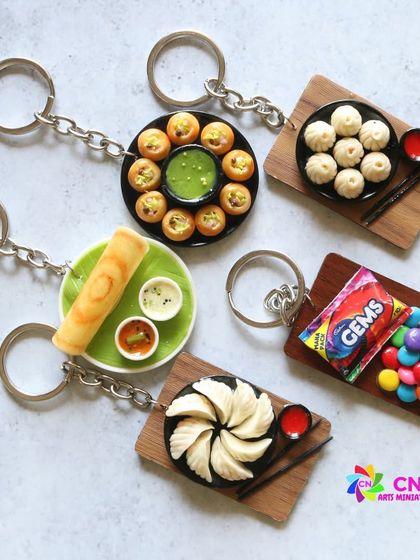 A collection of my food-themed keychains, including dosa, pani puri, and momos.