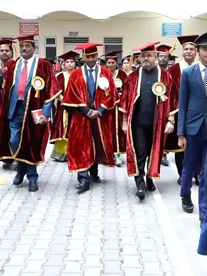 The formal procession, led by the college band, making its way to the event venue.