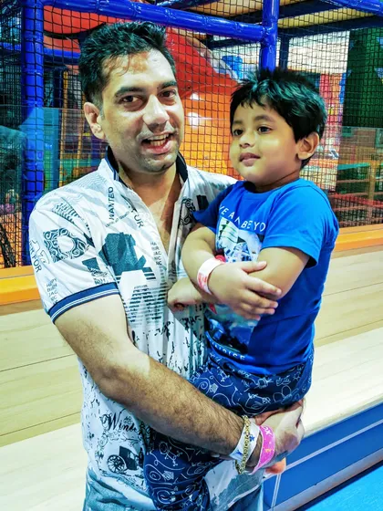 Capturing a sweet moment between a father and his son inside the play area on Father's Day.